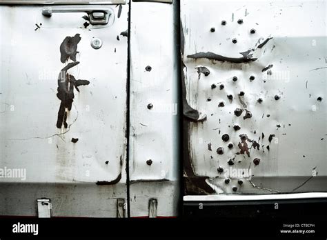 Detail Of The Door Of An Old Silver Pickup Truck With Rusted Bullet