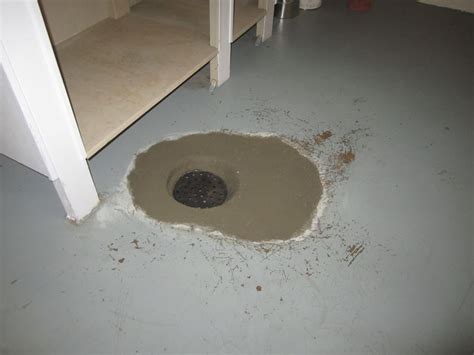 Removing mortar from concrete slab floor: Latest Projects - Floor Drain Replacement in Minneapolis, MN