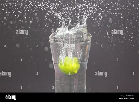 Fast Shutter Speed Capturing The Splash Caused By A Lime Being Dropped