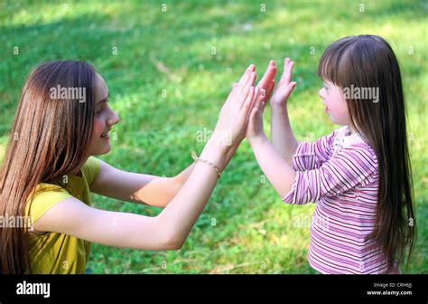 Portrait Of Beautiful Young Girls In The Park Stock Photo Alamy