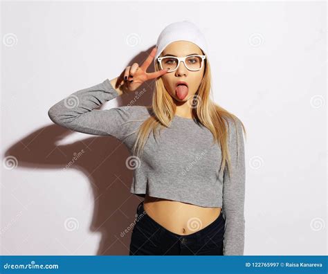 Emotional Girl Beautiful Modern Model Shows Tongue Emotions On Face White Background Stock