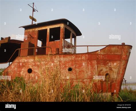Rusting Riverboat Abandoned On The Bank Of The Congo River At Kongolo