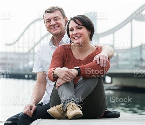 Positive Mature Couple In Love Posing Outdoors Stock Photo Download