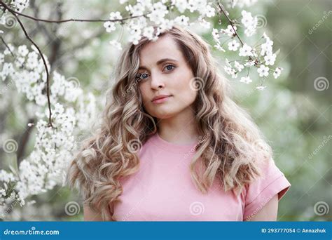 Portrait Of Beautiful Woman With Spring Flowering Tree Girl With Long
