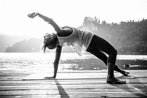 Doing Yoga By The Lake Stock Photo Download Image Now Istock