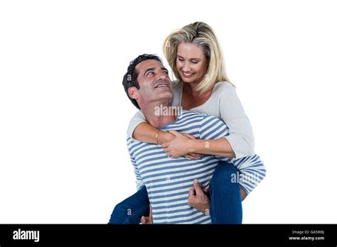 Romantic Man Carrying Woman Piggyback Stock Photo Alamy
