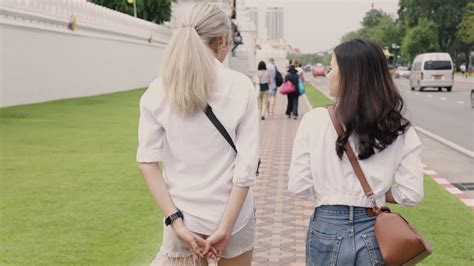 Asian Lesbian Couple Enjoying Traveling In Thailand And Having Fun