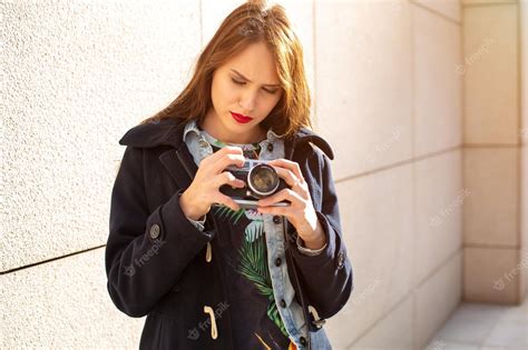 Premium Photo Happy Hipster Girl Making Photo With Retro Camera On
