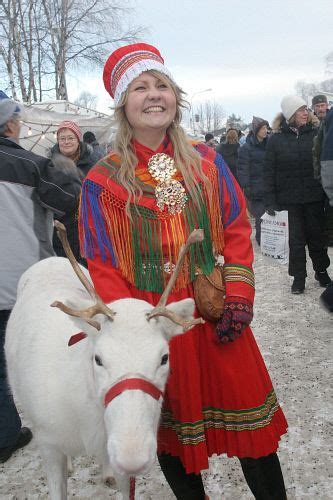 Saami Girl And A White Reindeer In The Reindeer Parade At The Jokkmokk