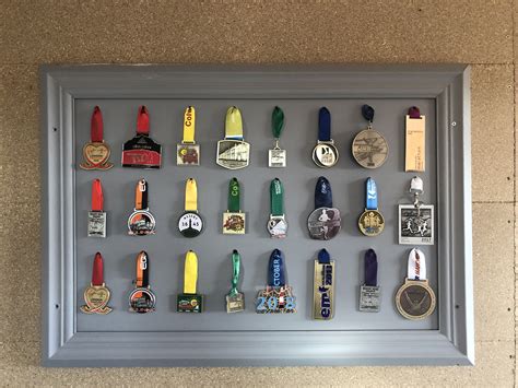 A Shadow Box With Many Medals On The Front And Back Of It All In