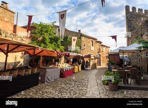 Gorgeous Medieval Village Market On Cobblestone Street With Flags