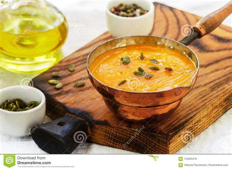 Pumpkin And Carrot Puree Soup With Seeds Pink Pepper And