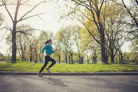 Woman Jogging In The Park By Stocksy Contributor Lumina Stocksy