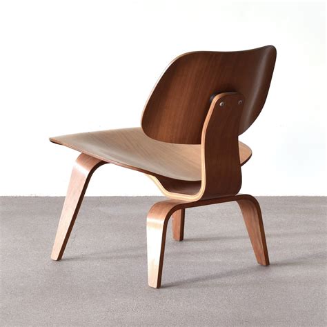 Herman miller tags on both pieces. American LCW Walnut Lounge Chair by Charles & Ray Eames ...