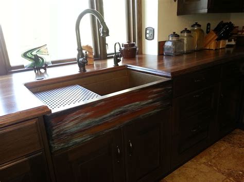 Rustic sinks has many products for that rustic kitchen style, such as copper & stone farmhouse sinks, copper range hoods and lighting. Copper Farmhouse workstation sink by Rachiele - Rustic ...