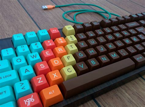 A Computer Keyboard With Colorful Keys On Top Of The Keyboard Is