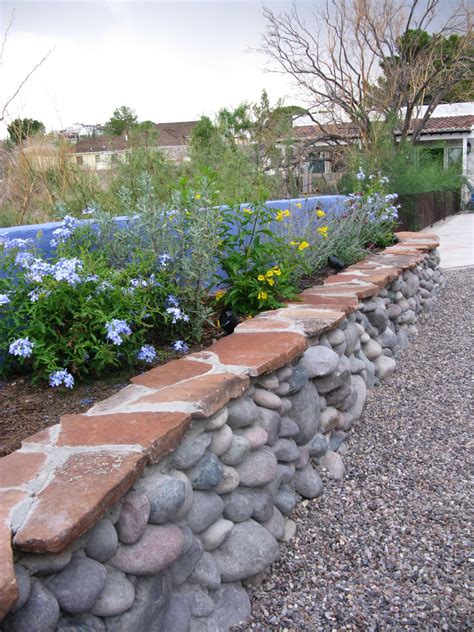 Desert Flower Bed Made From Flagstone And River Rock That Overlooks An
