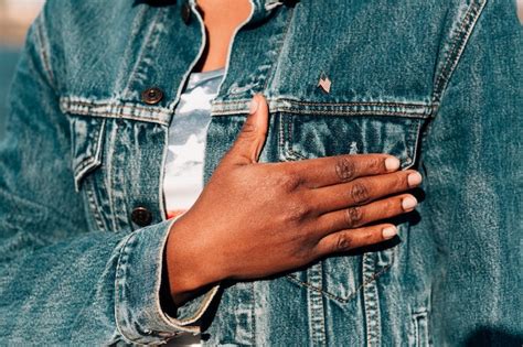 Free Photo Black Woman Holding Hand On Heart