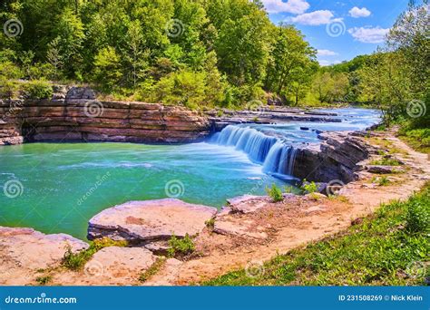 Vibrant Blue Waterfall Gorge Through Forest Stock Image Image Of Rock