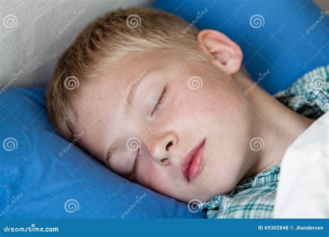Cute Boy Sleeping In Bed Stock Photo Image Of Tired 69302848