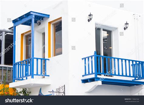 White Building With Blue Balcony Mediterranean Style Stock Photo