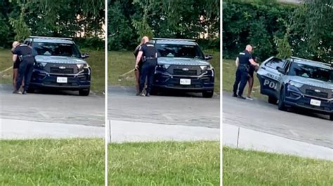 video us cop caught kissing scantily clad woman before climbing into police car with her