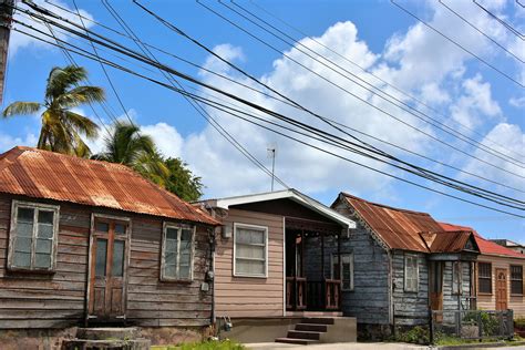 row of small wooden houses in bridgetown barbados encircle photos