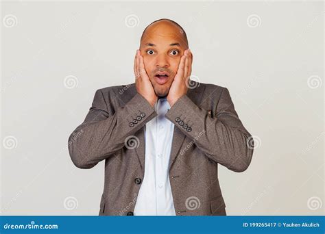 Shocked Young African American Guy Businessman Expressing Surprise And