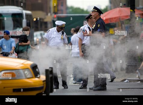 New York City Police Officers Patrolling Streets Of Manhattan New York