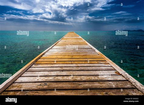 Empty Wooden Dock Over Tropical Blue Water Stock Photo Alamy