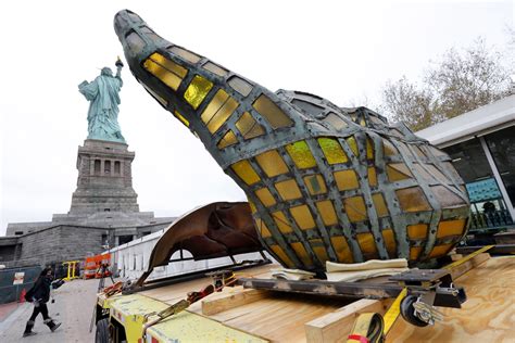 Vaxxed and masked, statue of liberty with vaccine and mask, new add to. New York - Statue Of Liberty's Original Torch Moved To Museum Site