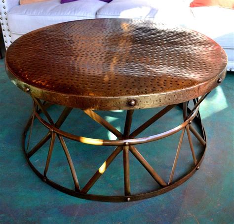 Lift the top to reveal hidden storage for blankets, toys, or pillows. 9 Hammered Metal Drum Coffee Table Ideas