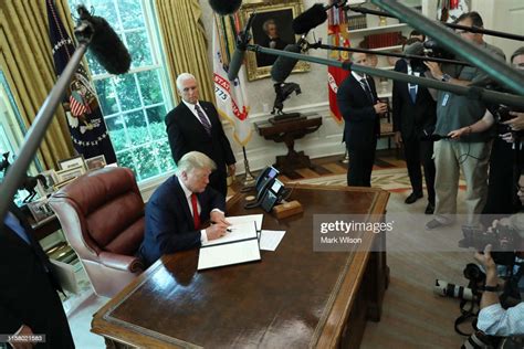 Us President Donald Trump Signs An Executive Order Imposing New