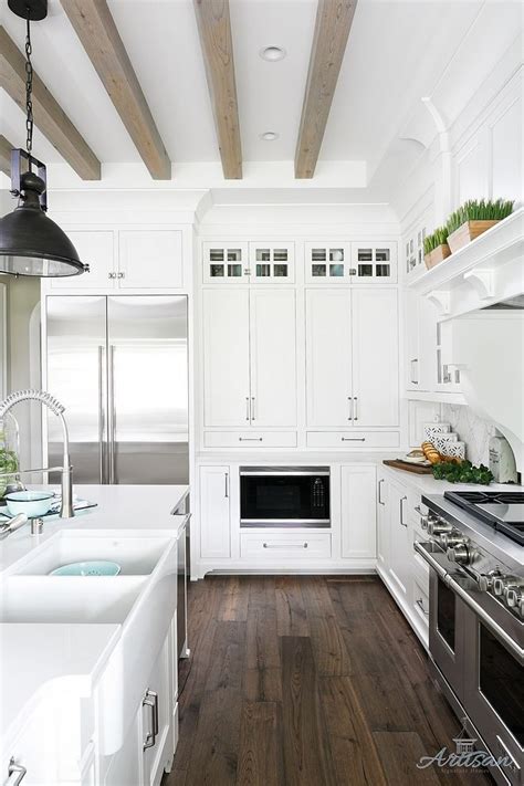 Hardwood flooring is versatile at adapting to any design theme. White Kitchen Dark Hardwood flooring and bleached ceiling beams White Kitchen Dar… | Interior ...