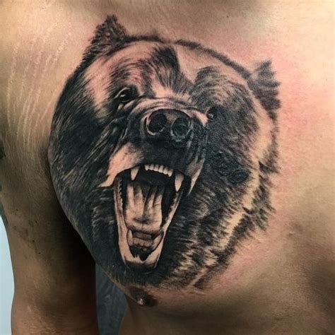 A collection of three separate bear tattoos for men, etched on their upper arms and extending towards the shoulder. Stunning Grizzly Bear Tattoo Ideas // February, 2021 ...