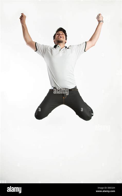 Young Man Jumps Into The Air Hi Res Stock Photography And Images Alamy
