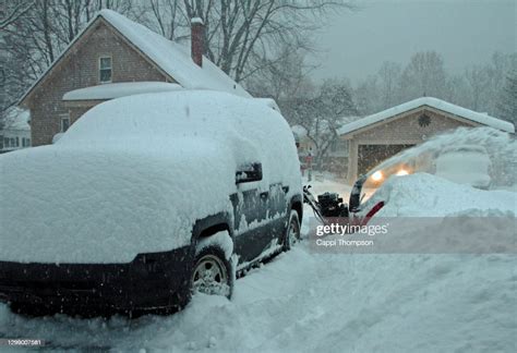 Snowblower Blowing Snow Out Of Driveway In New Hampshire Usa During