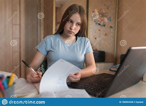 Teenager Girl Writing In Notebooks And Assignment Notes Home Education