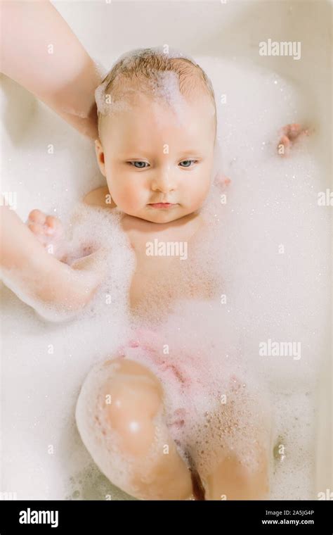 Happy Laughing Baby Taking A Bath Playing With Foam Bubbles Little