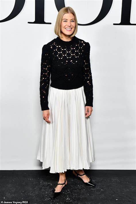 Rosamund Pike Looks Elegant In A Black Knitted Jumper And White Skirt