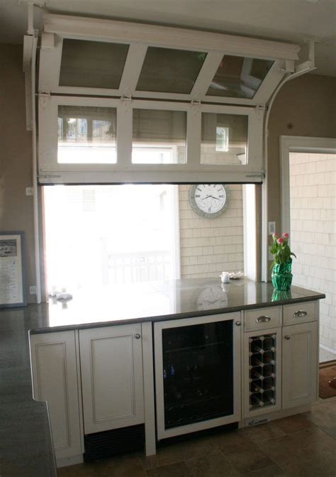 Garage door openers are highly convenient, but sometimes they may need a professional touch to bring them back into good shape. Garage bar ideas kitchen traditional with garage door ...