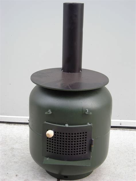 So, i had chilly fingers sitting in my tent watching the wasted heat shimmer away out the vent in the top of my coleman tent. Heater / Cooker | Gas bottle wood burner, Diy wood stove, Wood stove