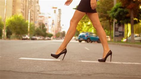 Close Up Details Female Legs Wearing High Heels Shoes Walking On The Road In Urban Modern City