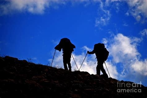 Silhouette Of People Hiking On Mountainside Photograph By Lane Erickson
