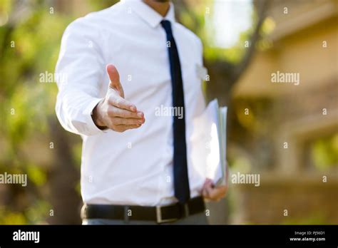 Confident Businessman Extending Hand For Handshake Stock Photo Alamy