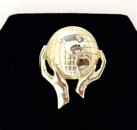 vintage gold tone world in hands statement brooch signed ajc etsy uk vintage gold gold