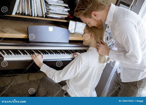 Loving Young Couple Playing Piano Stock Photo Image Of House