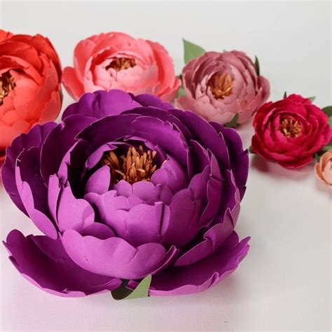 Violet Paper Peony Surrounded By Smaller Pink Paper Peonies Paper