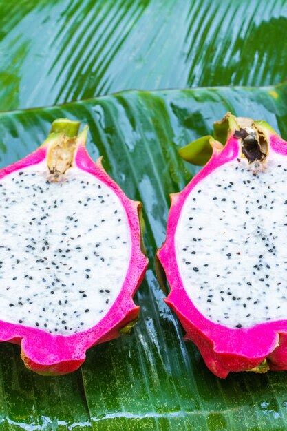 Premium Photo Ripe Dragon Fruit On A Wet Green Leaf Vitamins Fruits