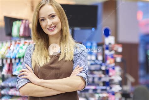 Portrait Of Sales Clerk At Supermarket Royalty Free Stock Image